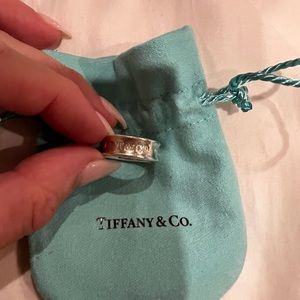 Authentic Tiffany and Co sterling silver ring band, size 5